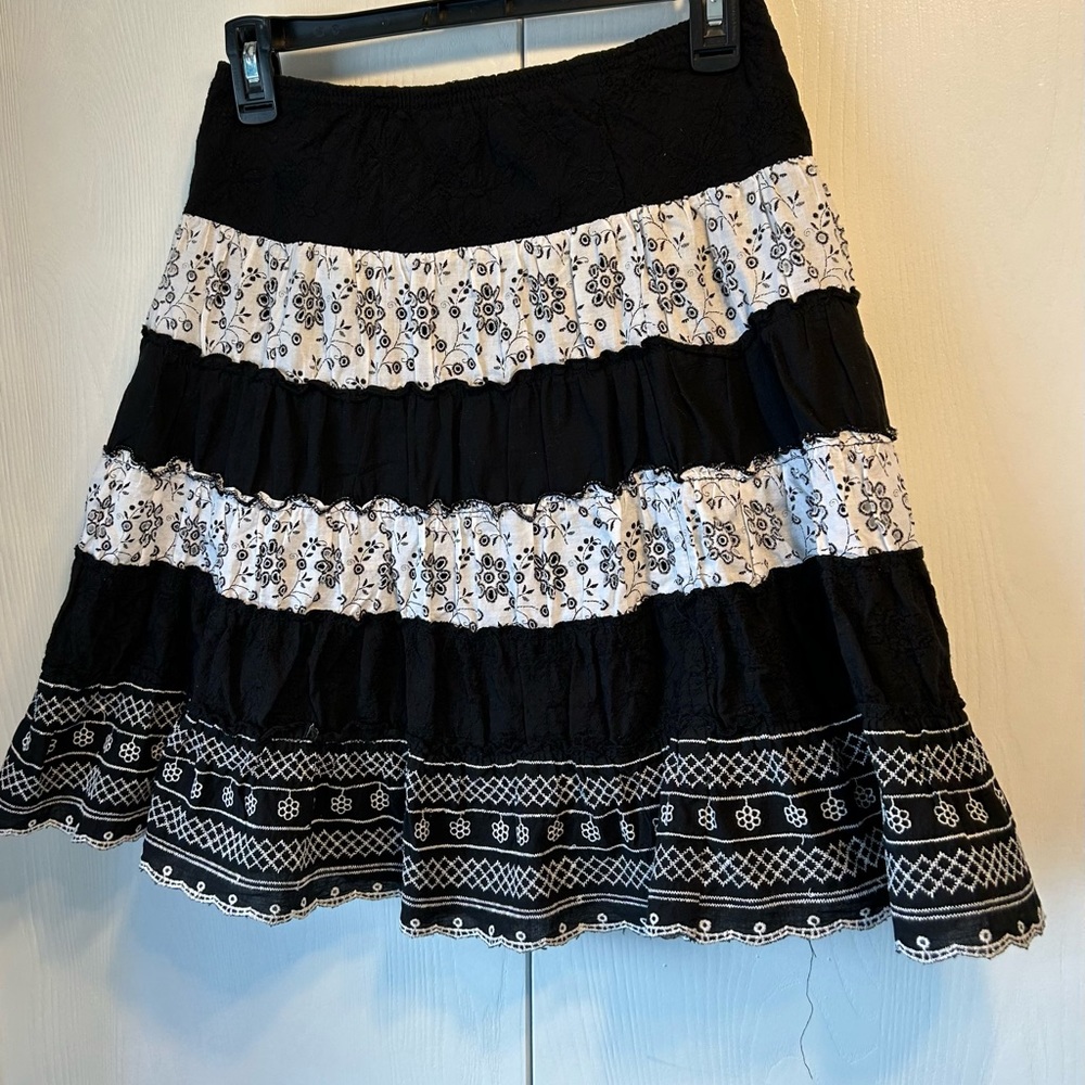 Young trendy black and white striped skirt with variety of different materials. - Picture 2 of 2